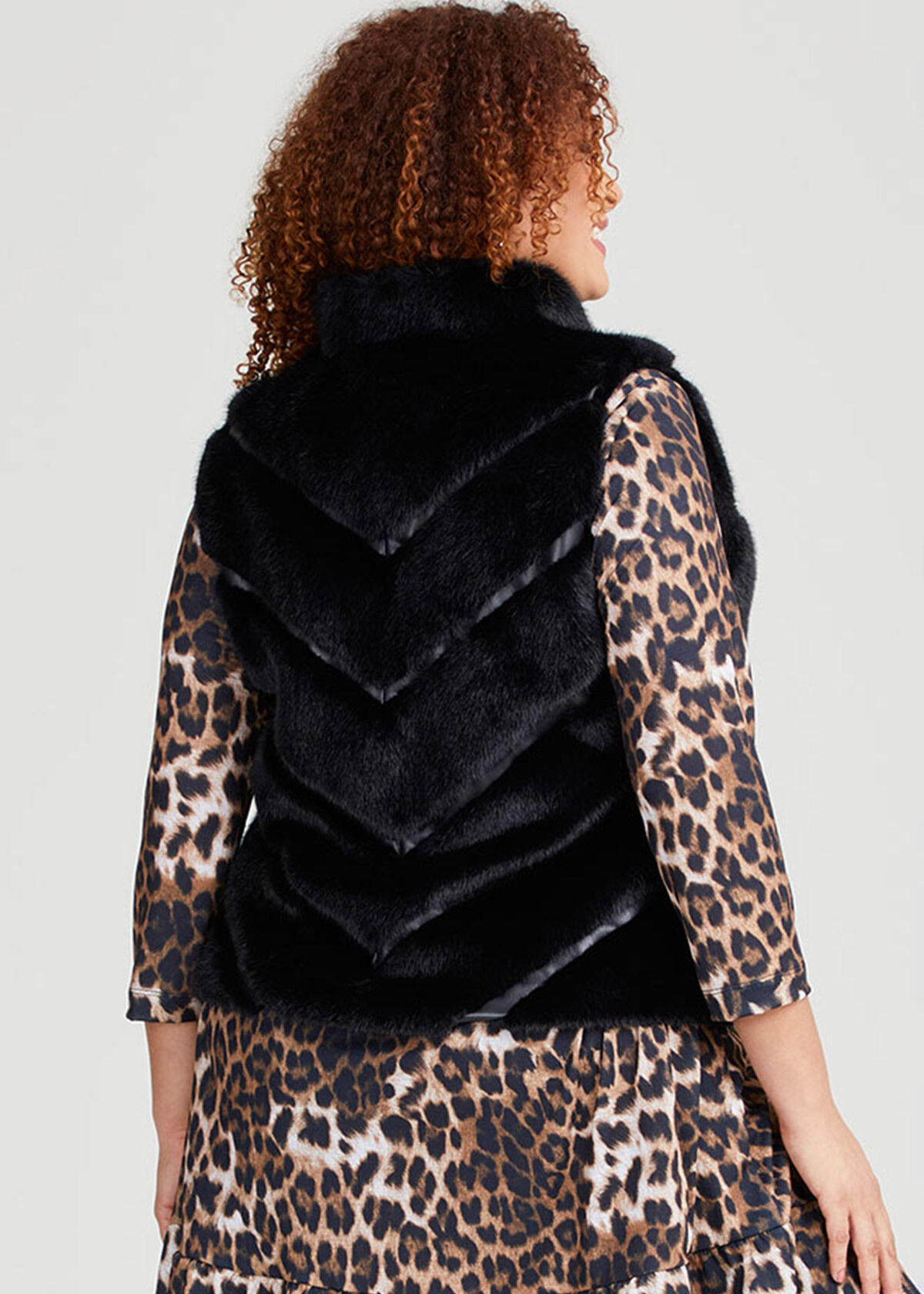 Shop Plus Size Faux Fur Chevron Vest in Black Taking Shape AU