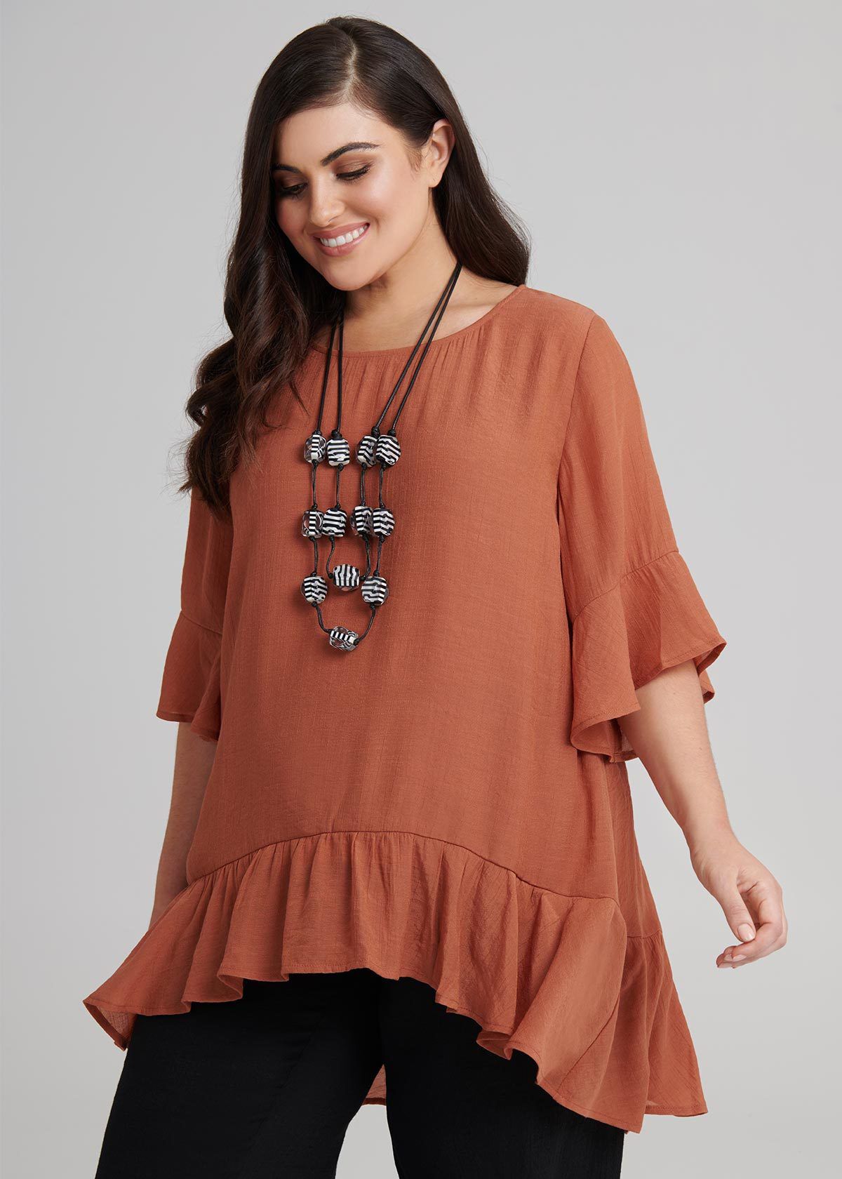 orange flowy top