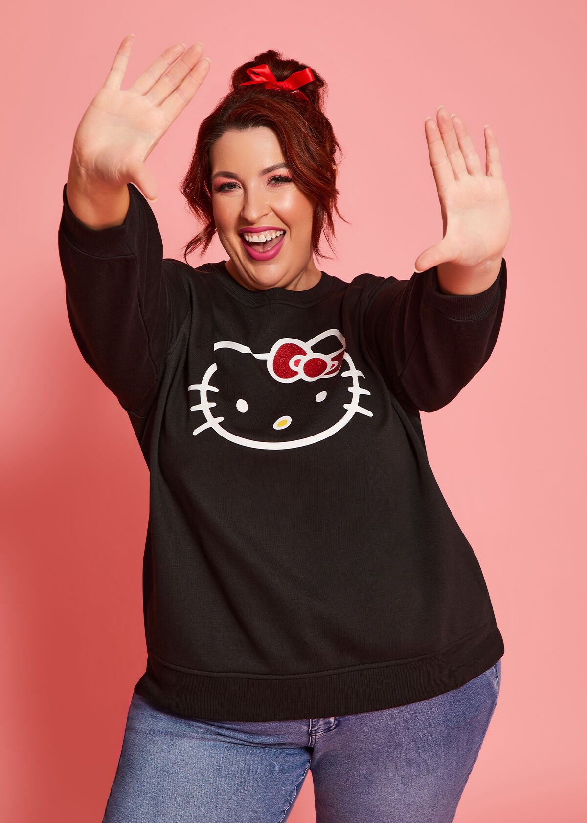 Shop Plus Size Hello Kitty Black Sweatshirt in Black Taking Shape AU
