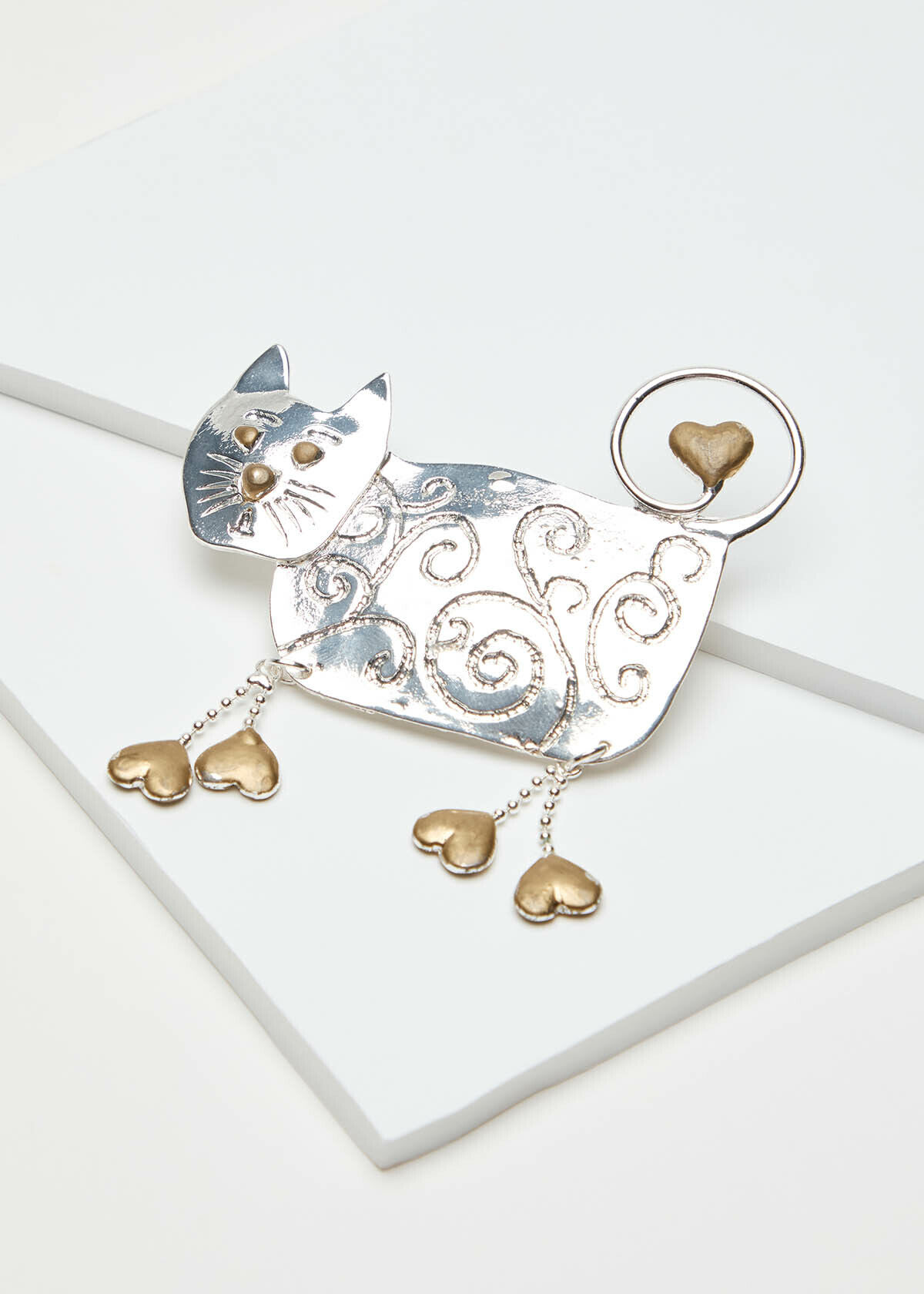 Silver shop cat brooch
